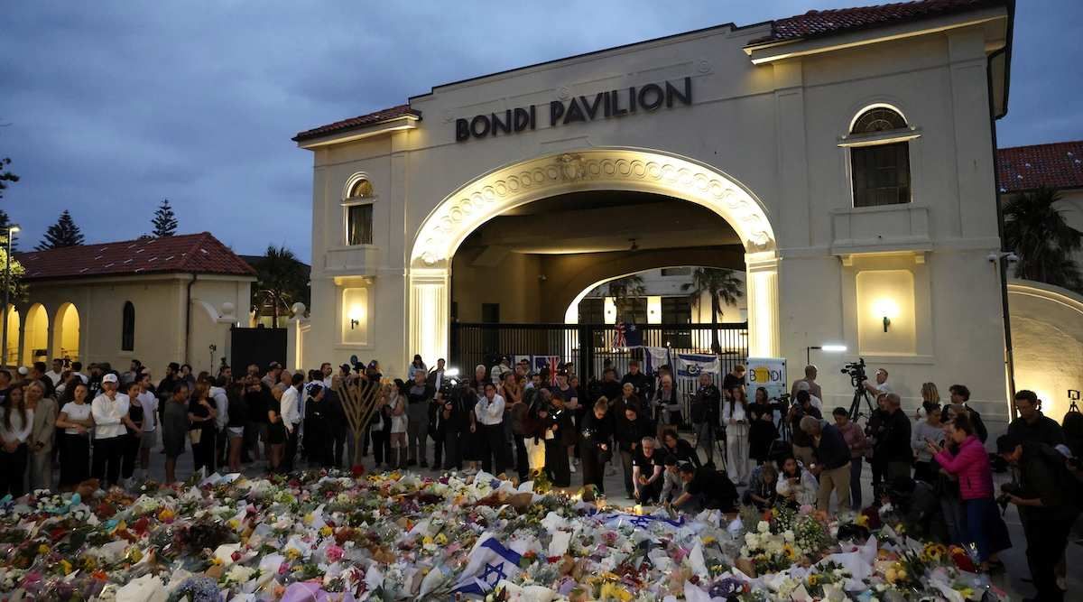People pay respects at Bondi Pavilion to victims of a shooting during a Jewish holiday celebration at Bondi Beach, in Sydney, Australia, December 15, 2025.