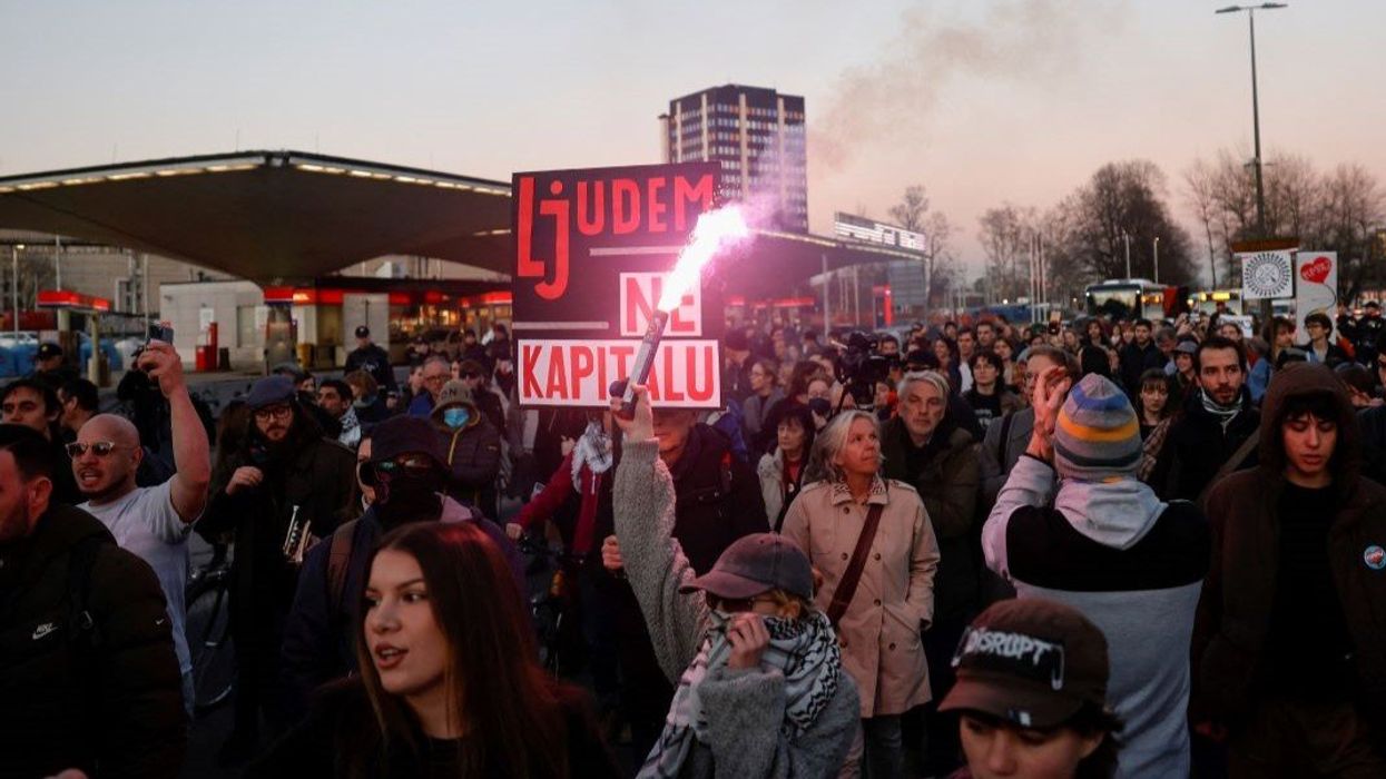 People protest Ljubljana's Mayor Zoran Jankovic's support of Serbia's President Aleksandar Vucic near the Serbian embassy in Ljubljana, Slovenia, on March 5, 2025.