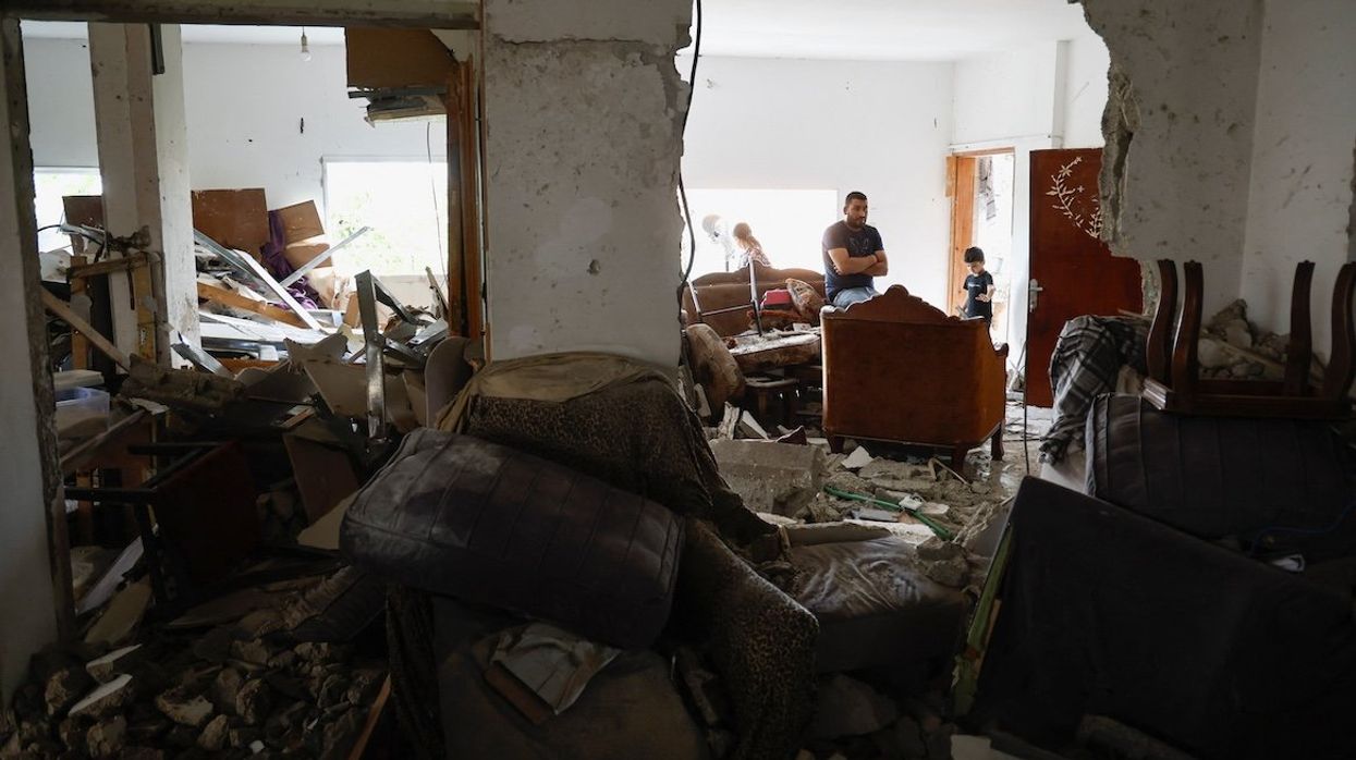 People react inside a damaged residence following an Israeli raid, in Jenin, in the Israeli-occupied West Bank, on Sept. 6, 2024.