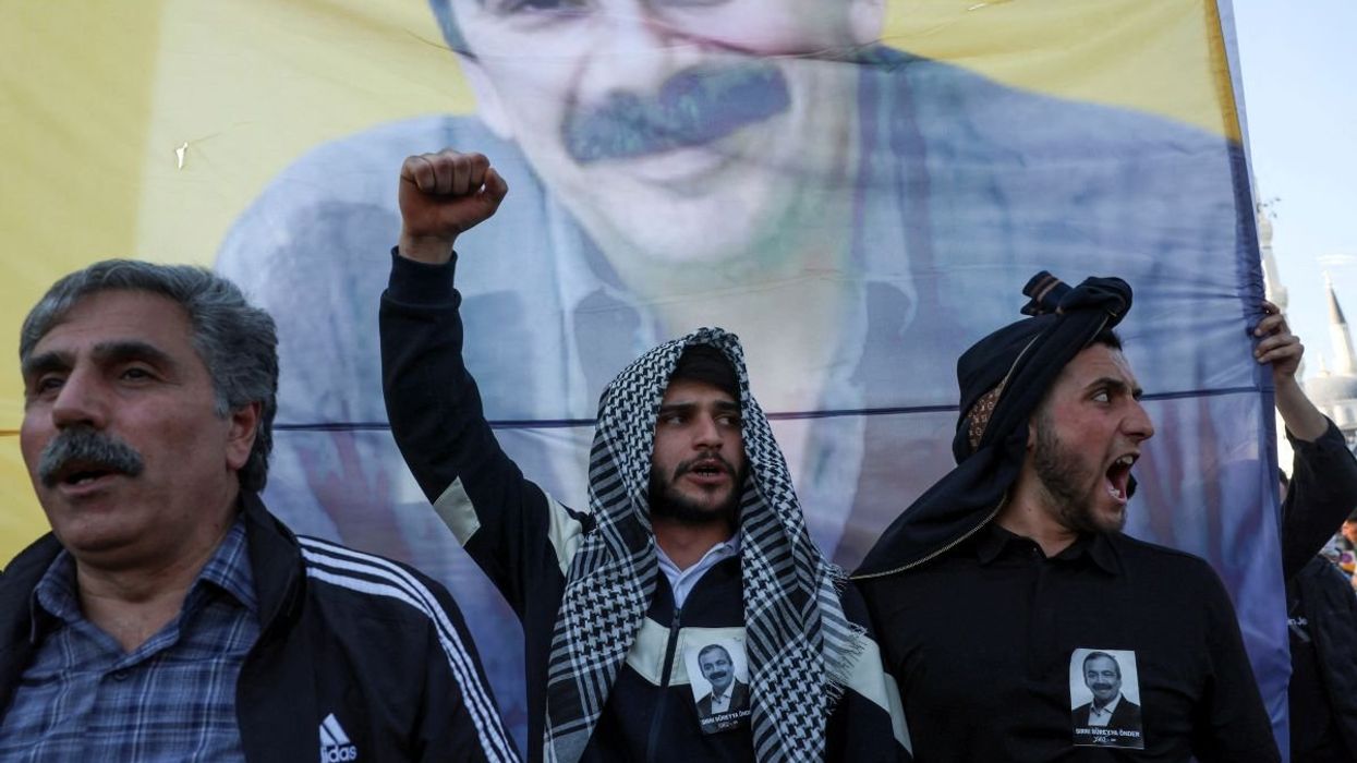 People shout slogans at the funeral of a pro-Kurdish lawmaker in Istanbul, Turkey, on May 4, 2025.