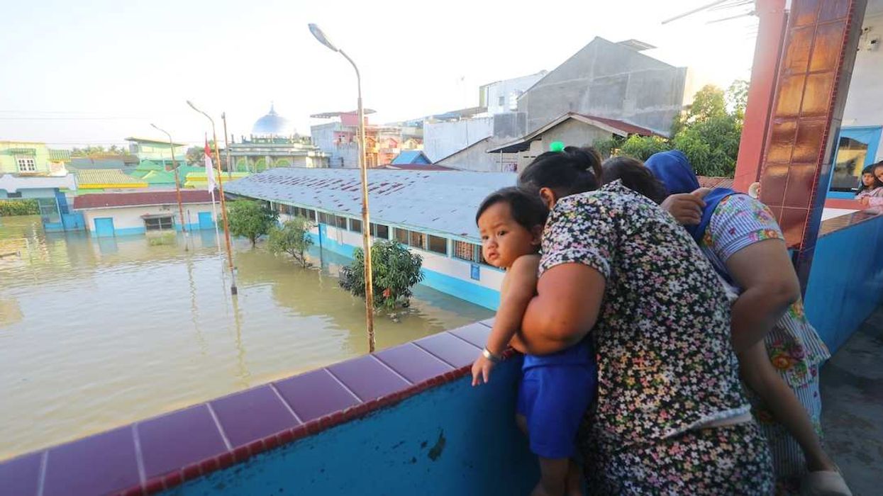 People stay at a school, which is functioned as the temporary shelter at flooded area, on November 30, 2025 in Sumatra, Sumatra. The authorities in Indonesia were searching on Sunday for hundreds of people they said were missing after days of unusually heavy rains across Southeast Asia that have killed hundreds and displaced millions.