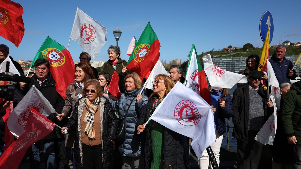 People wait for Socialist Party (PS) Secretary General Pedro Nuno Santos to arrive for a campaign rally ahead of the snap elections in Afurada, Vila Nova de Gaia, Portugal, March 4, 2024.