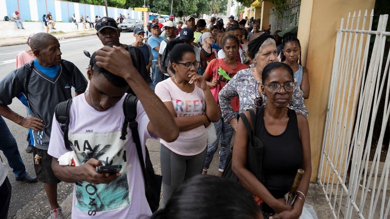 People wait in line to buy bread before Rafael's arrival in Havana, Cuba, on Nov. 5, 2024.