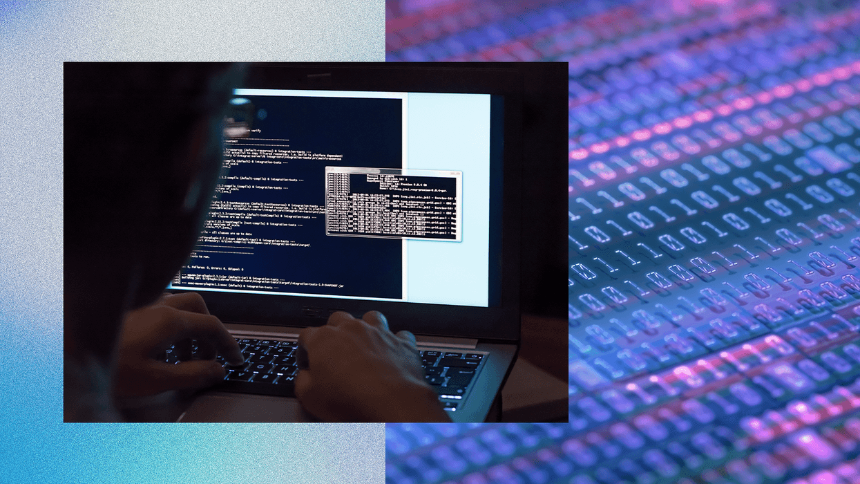 Person coding on a laptop