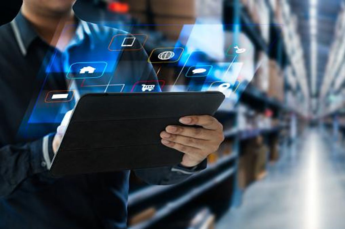 Person holding digital tablet, with an animation of the digital screen appearing