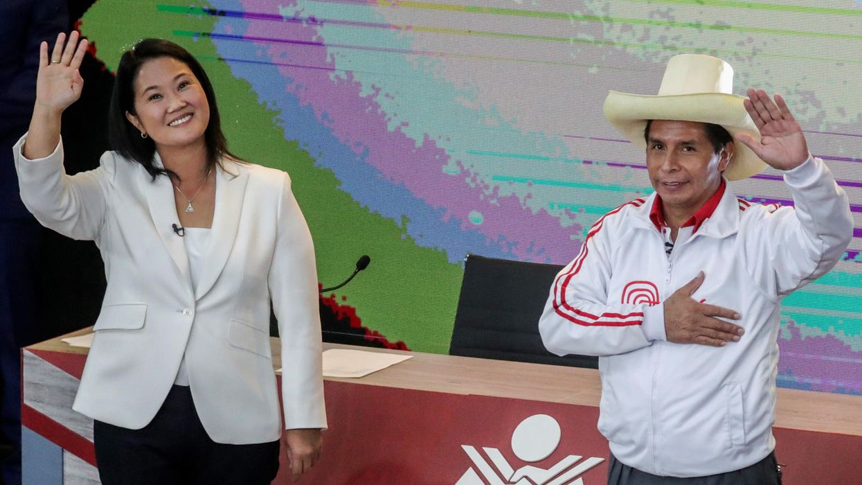 Peru's right-wing candidate Keiko Fujimori and socialist candidate Pedro Castillo wave at the end of their debate ahead of the June 6 run-off election, in Arequipa, Peru May 30, 2021.