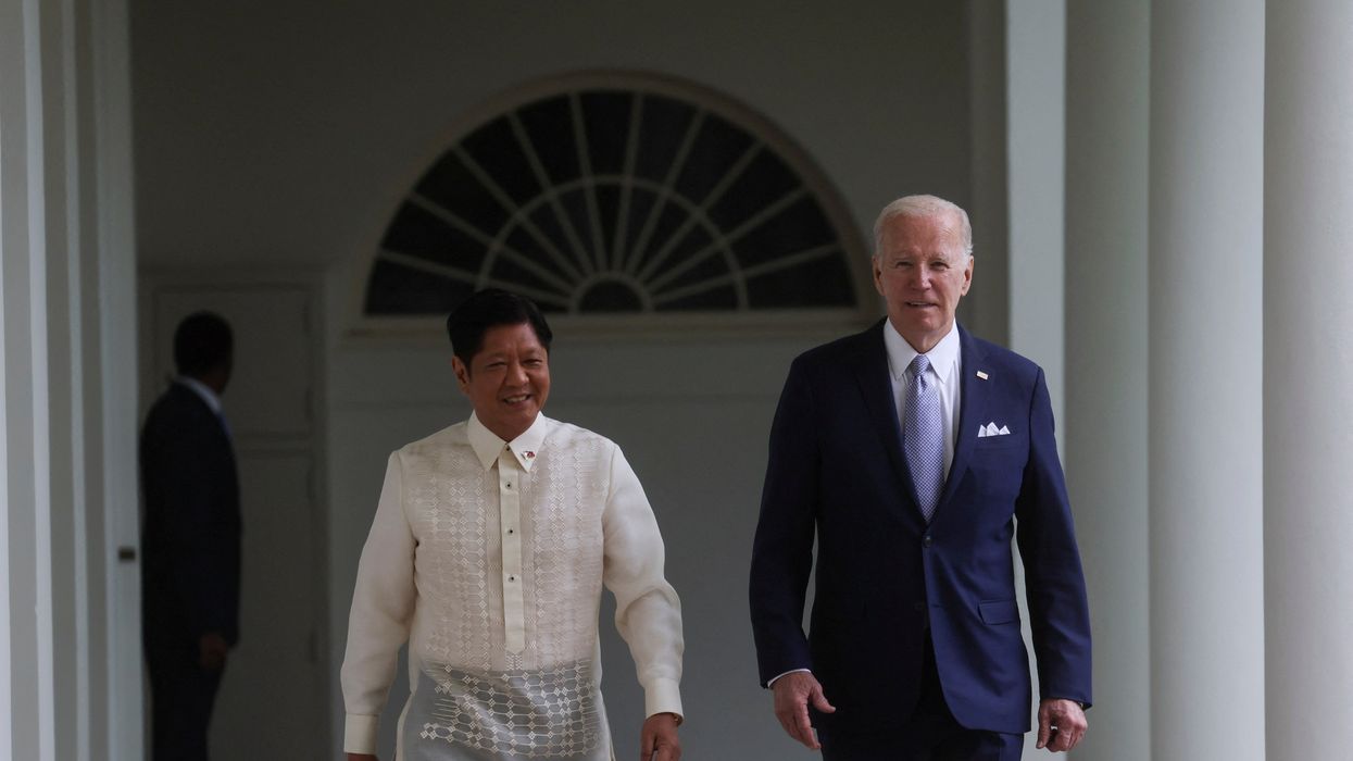 Philippine President Ferdinand Marcos Jr. and US. President Joe Biden walk to the Oval Office at the White House in Washington, DC.