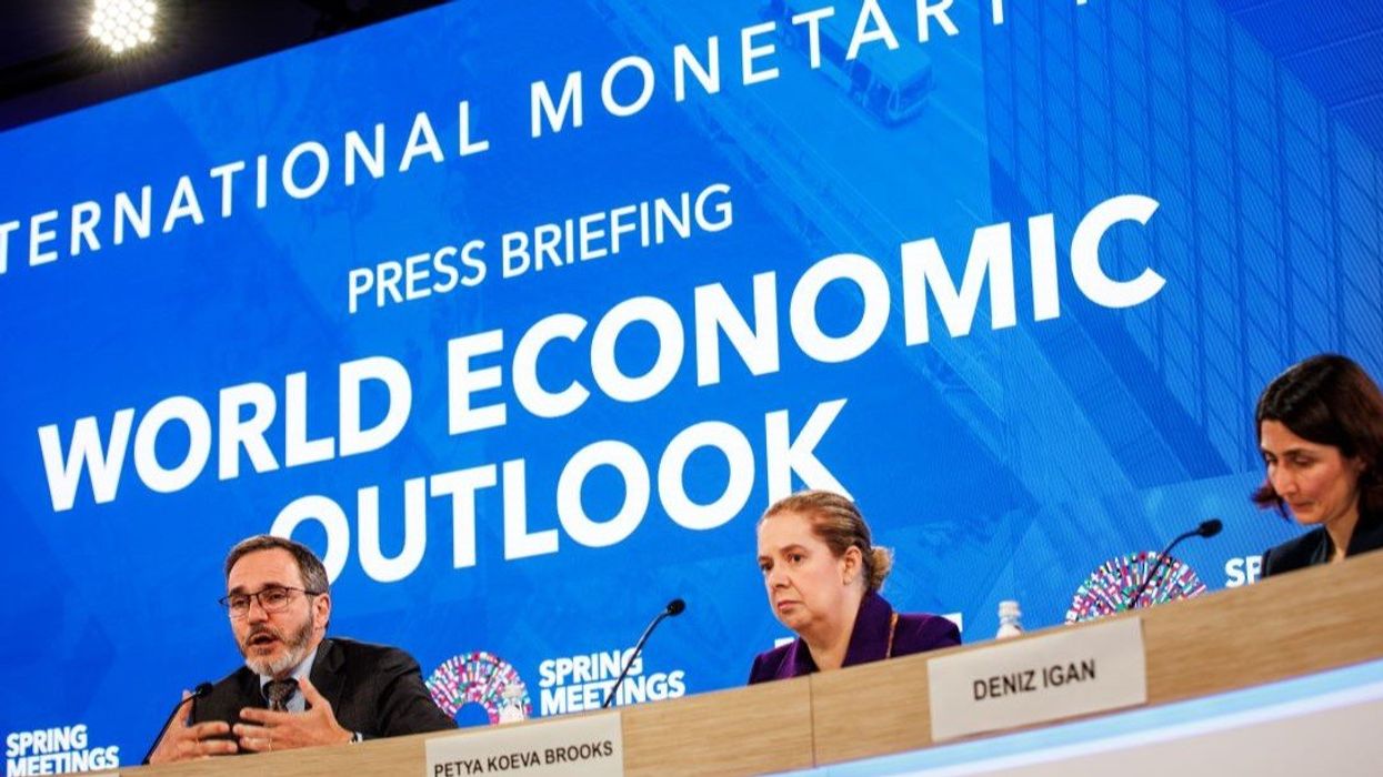 Pierre-Olivier Gourinchas (left), Director of the Research Department at the International Monetary Fund (IMF), speaks during a press briefing on the World Economic Outlook during the 2025 World Bank and IMF Spring Meetings on April 22, 2025 in Washington, DC.