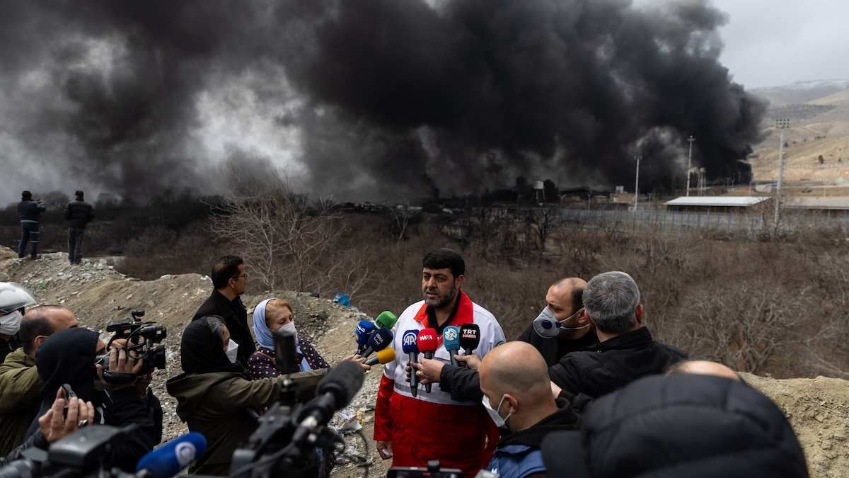 Pirhossein Kolivand, head of the Iranian Red Crescent Society, stands in front of the Shahran oil depot, which was targeted by US-Israeli strikes, in western Tehran, Iran, on March 8, 2026.