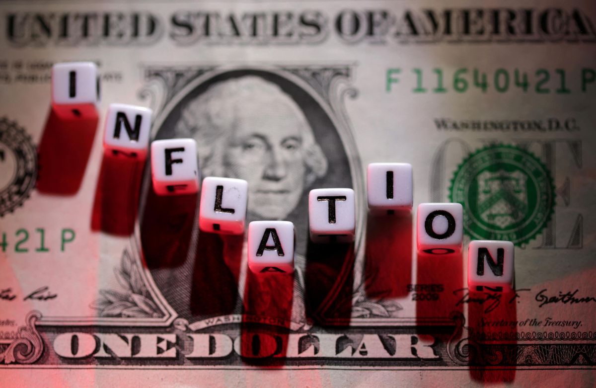 Plastic letters arranged to read "inflation" are placed on a US dollar banknote.