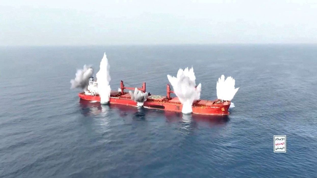 Plumes of smoke rise from what is said to be a Greek-operated bulk carrier, in a handout video released on July 8, 2025