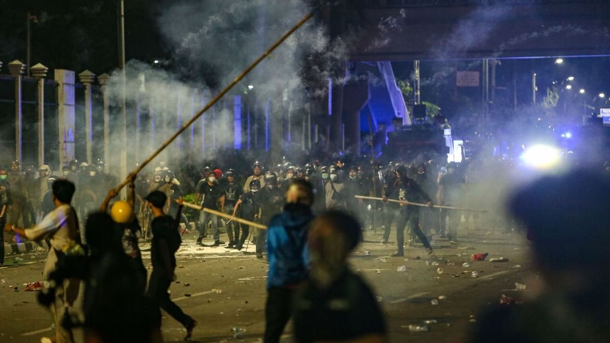 Police officers disperse protesters in Jakarta, Indonesia, on August 30, 2025.
