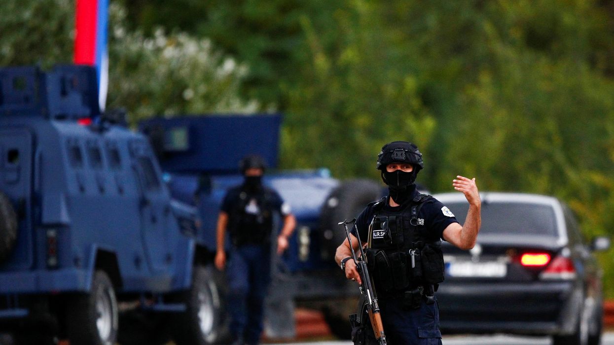 Police officers patrol in the aftermath of a shooting, at the road to Banjska village, Kosovo September 24, 2023.