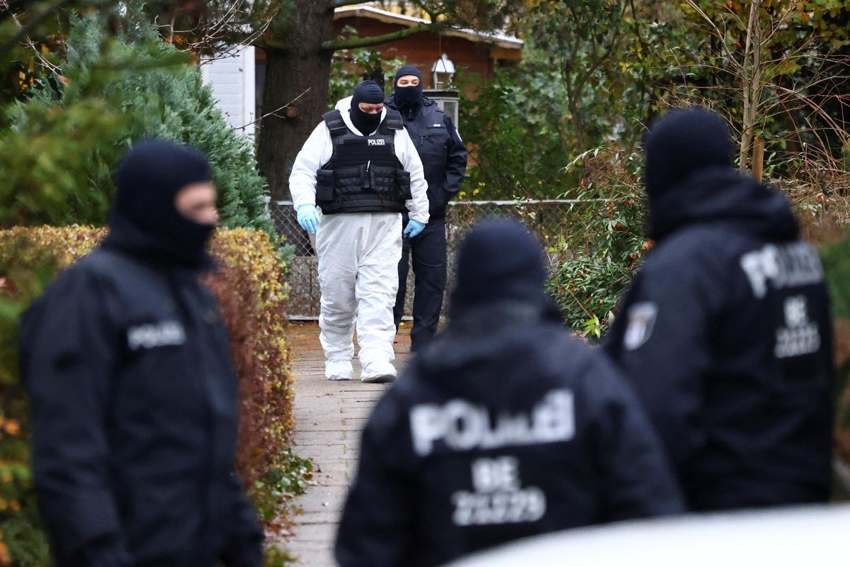 Police secures the area in Berlin after 25 suspected members and supporters of a far-right group were detained during raids across Germany.