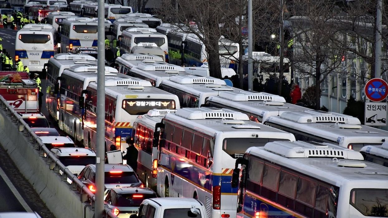 Police vans are lined up in front of South Korean President Yoon Suk Yeol's official residence in Seoul on Jan. 3, 2025.