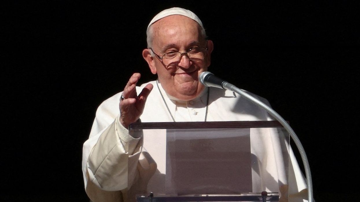 Pope Francis leads the Angelus prayer from his window, at the Vatican, December 17, 2023.