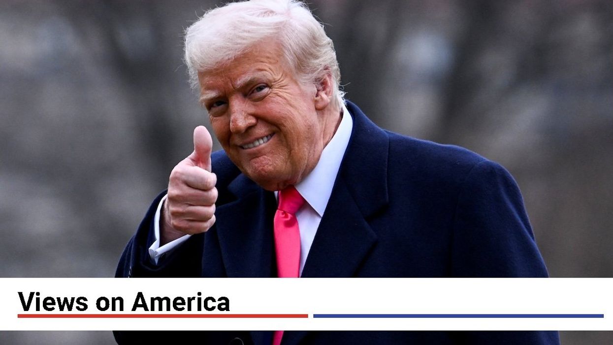 President Donald Trump giving a thumbs up.