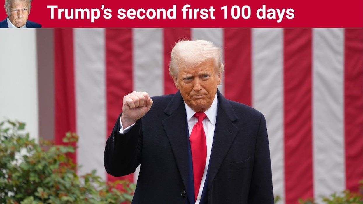 President Donald Trump raises a fist during a ceremony where he signs two executive orders that will lead to reciprocal tariffs against other countries that charge tariffs on US goods.