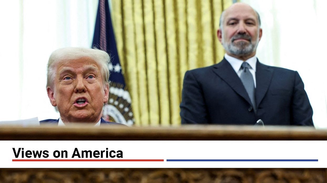 President Donald Trump speaks from the Oval Office flanked by Commerce Secretary Howard Lutnick on the day he signed executive orders for reciprocal tariffs, Feb. 13, 2025.