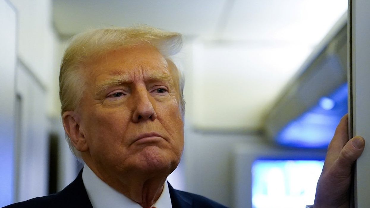 President Donald Trump speaks to reporters aboard Air Force One before arriving at Joint Base Andrews, Maryland, on Jan. 27, 2025.