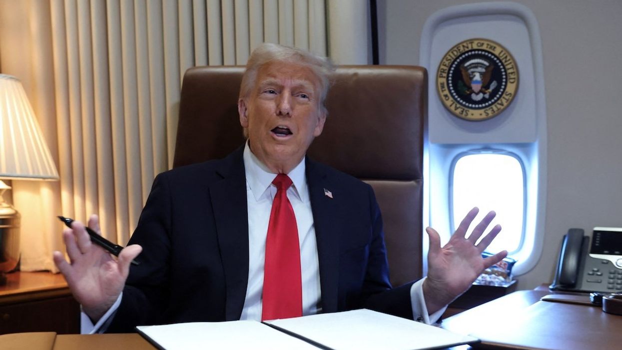 President Donald Trump speaks to reporters aboard Air Force One en route to New Orleans to attend the Super Bowl, on Feb. 9, 2025.
