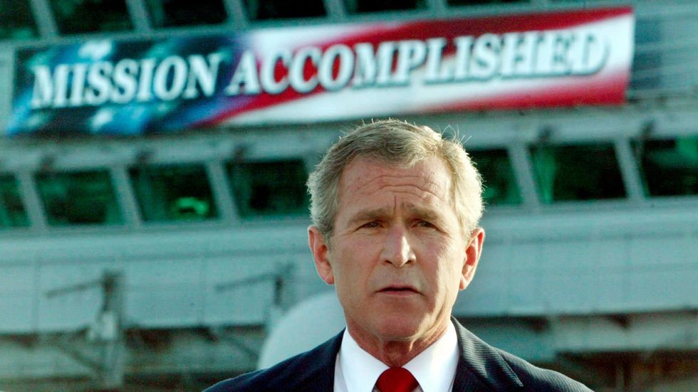 President George W. Bush delivering a speech to crew aboard the USS Abraham Lincoln in May 2003.