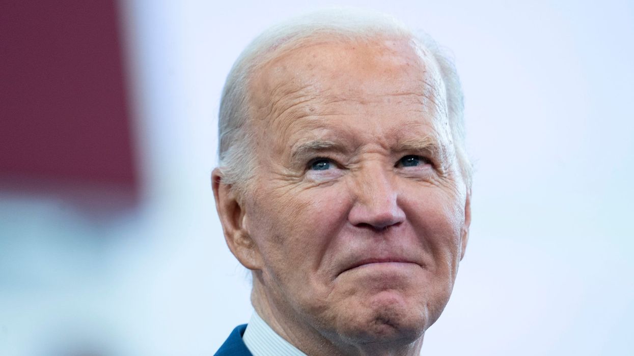 President Joe Biden appears to get emotional when the crowd chants ÒdonÕt give upÓ before he delivers a speech to a large crowd at Renaissance High School in Detroit on Friday, July 12, 2024.
