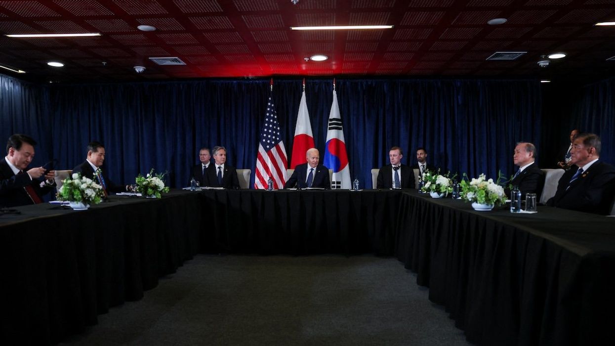 President Joe Biden, South Korea's President Yoon Suk Yeol, and Japan's Prime Minister Shigeru Ishiba participate in a trilateral meeting at the Asia-Pacific Economic Cooperation summit in Lima, Peru, on Nov. 15, 2024.