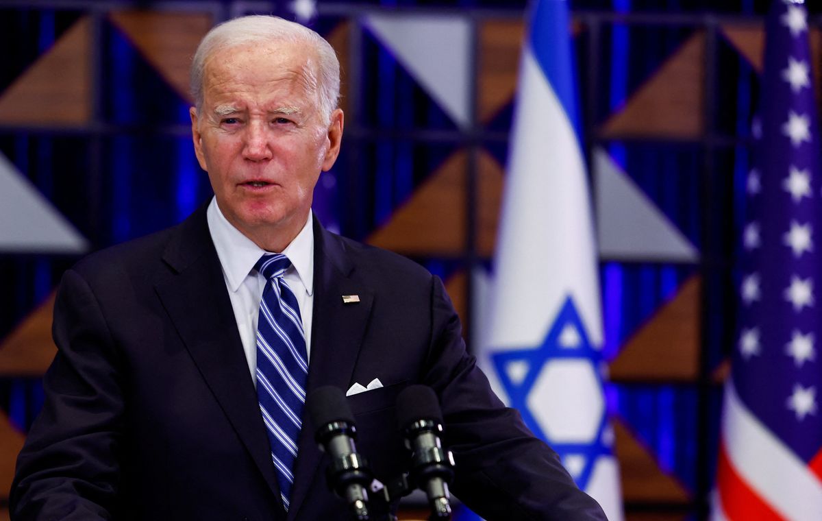 President Joe Biden speaks to the press aboard Air Force One en route from Israel, at Ramstein Air Base, Germany, Oct. 18, 2023.