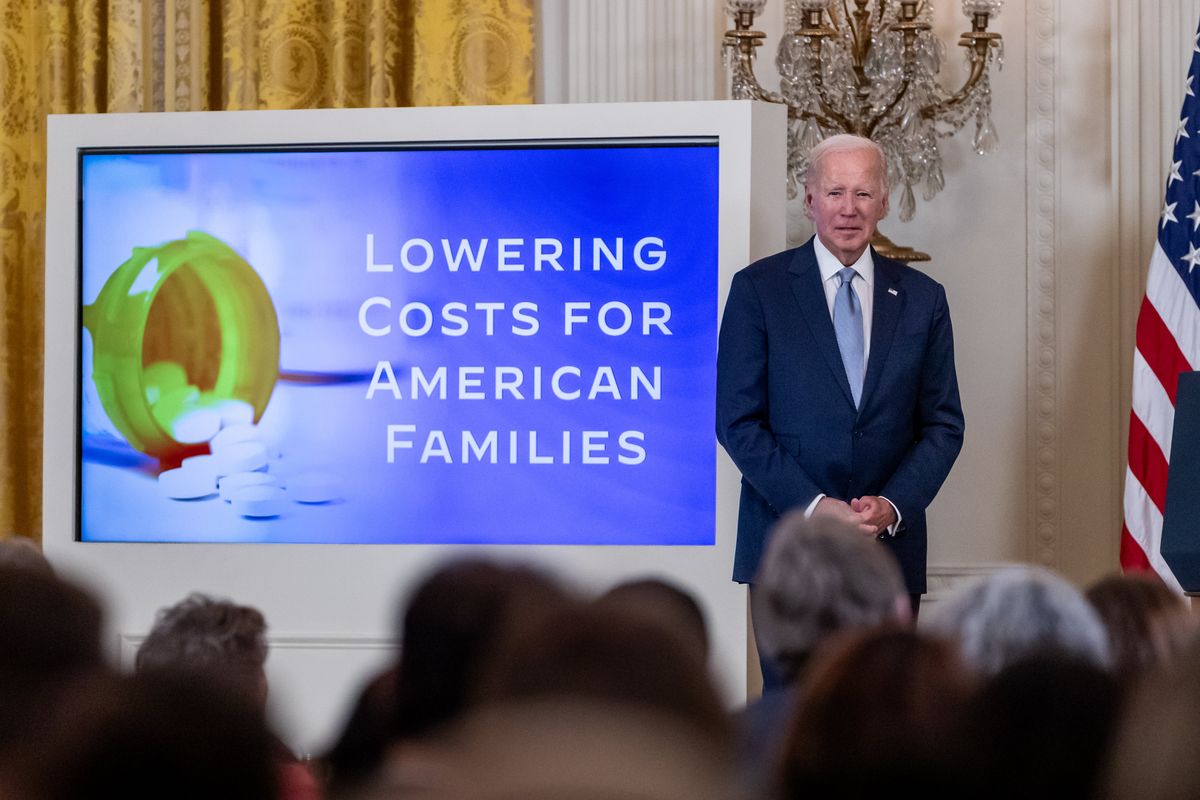 President Joe Biden waits on stage during a White House event announcing moves to lower the prices of ten widely-used prescription drugs