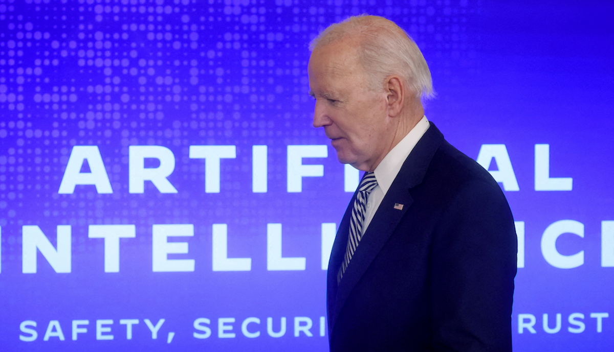 President Joe Biden walks across the stage to sign an executive order about artificial intelligence at the White House on Oct. 30, 2023. 