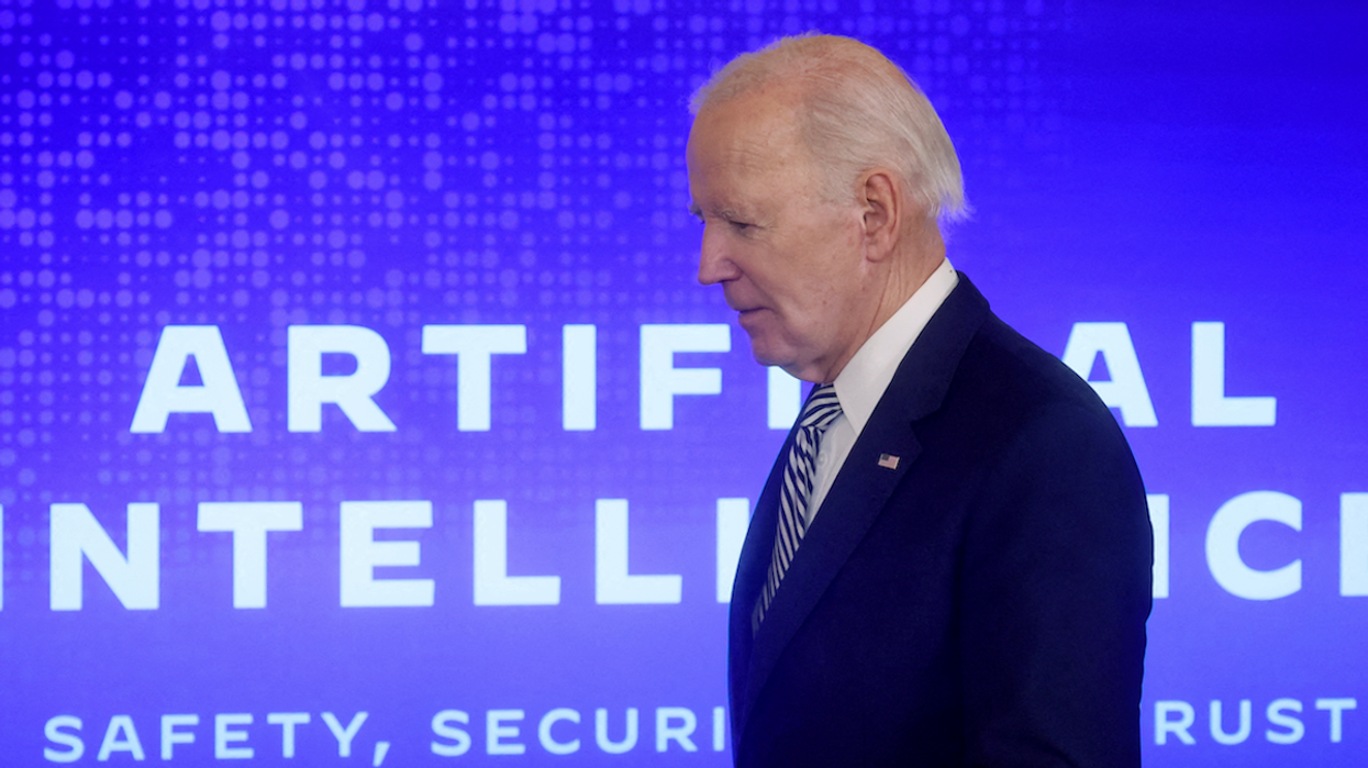 President Joe Biden walks across the stage to sign an executive order about artificial intelligence at the White House on Oct. 30, 2023.