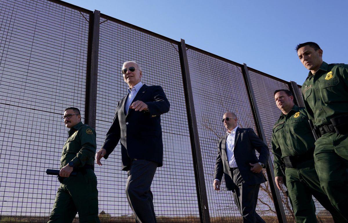 President Joe Biden walks along the border fence during his visit to the US-Mexico border in El Paso, Texas.