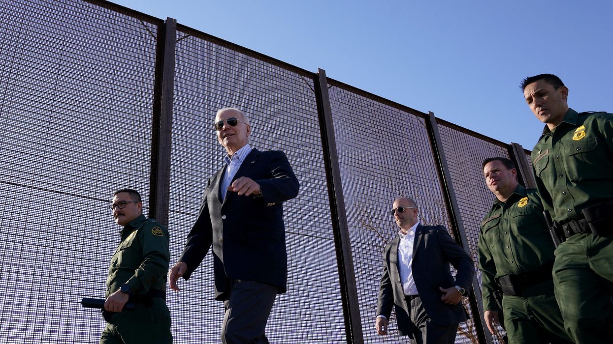 President Joe Biden walks along the border fence during his visit to the US-Mexico border in El Paso, Texas.