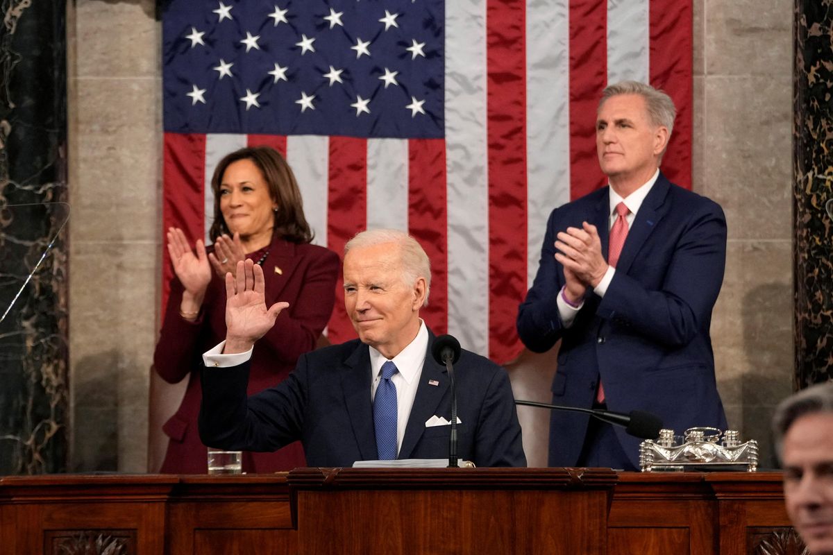 President Joe Biden waves as he delivers the State of the Union address to a joint session of Congress. 