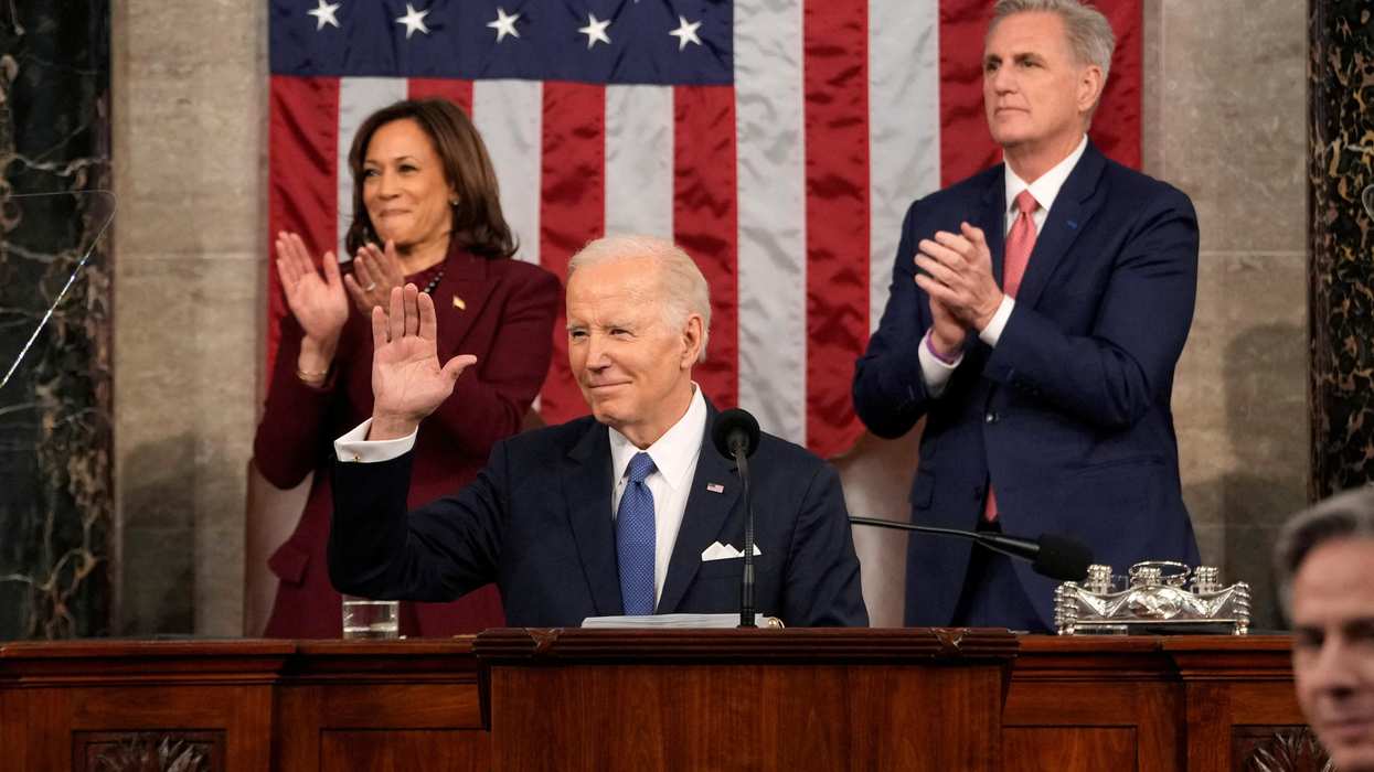 President Joe Biden waves as he delivers the State of the Union address to a joint session of Congress.