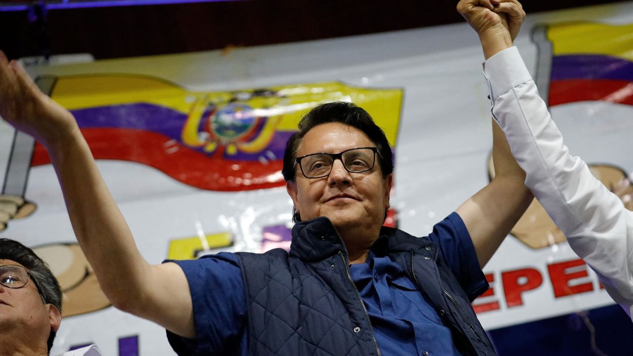 Presidential candidate Fernando Villavicencio waves an Ecuadorian flag as he attends a rally in Quito, Ecuador, on Aug. 9, 2023.