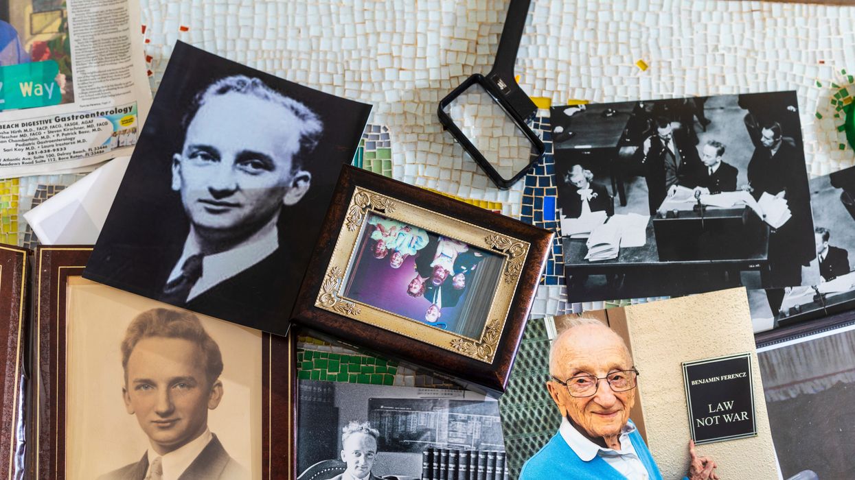 Print photocopies of Benjamin Ferencz, while he served as a prosecutor during the Nuremberg trials, on a table at his home in Delray Beach, Florida on June 1, 2022.