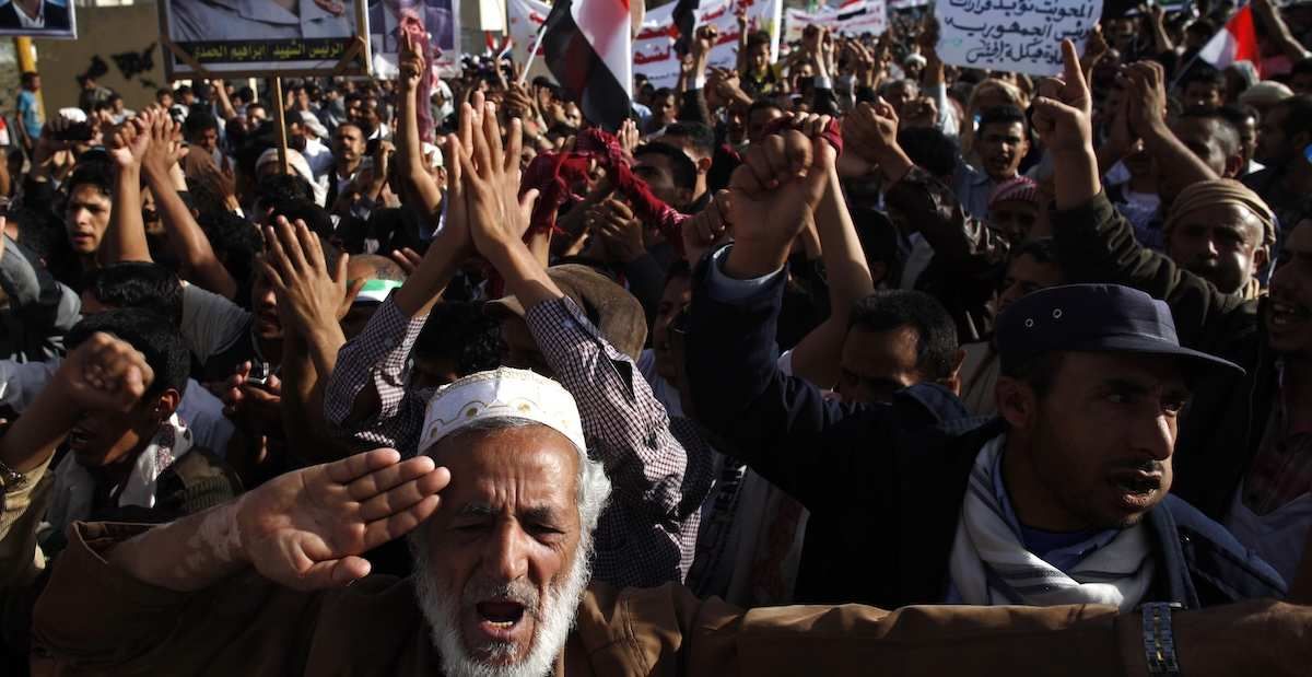 Pro-democracy protesters carry portraits of North Yemen's late president Ibrahim al-Hamdi.