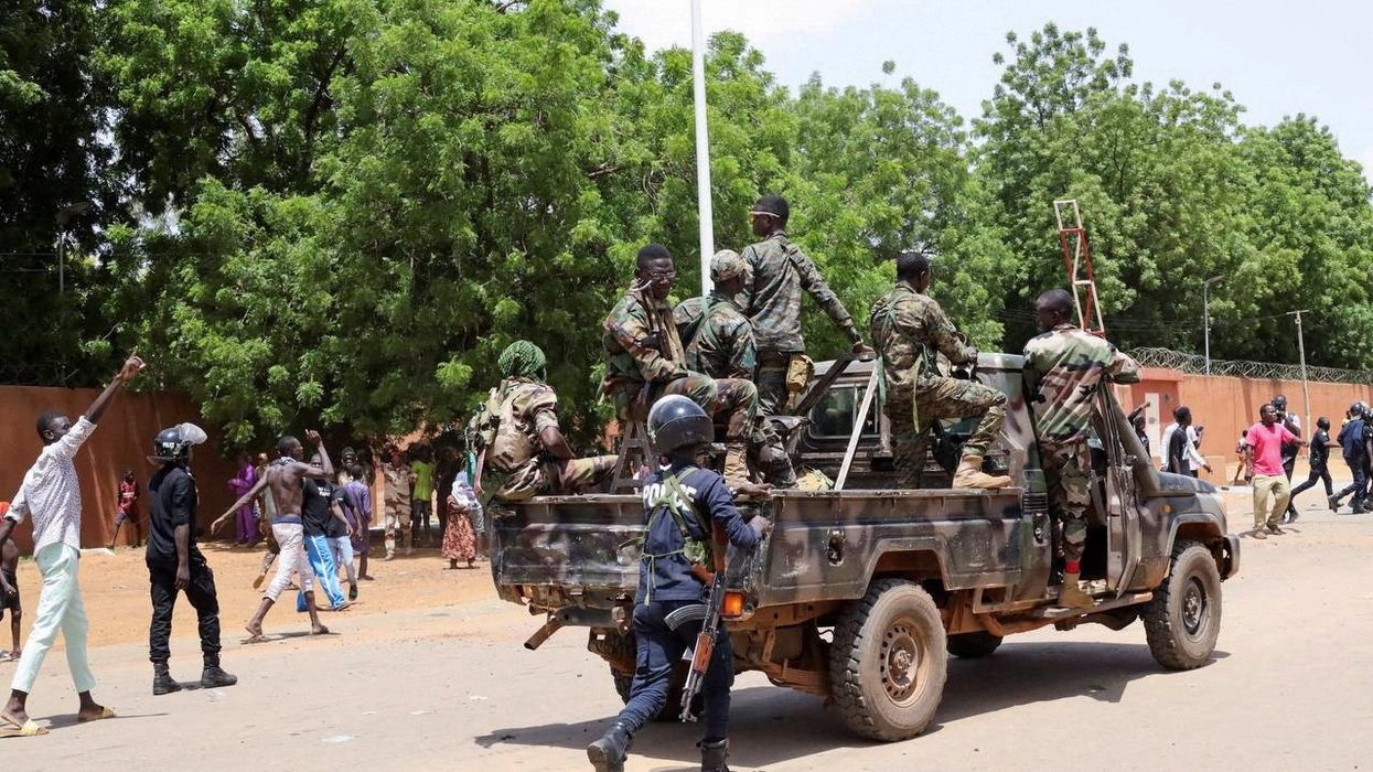 Pro-junta protesters gather outside the French Embassy in Niamey, Niger.