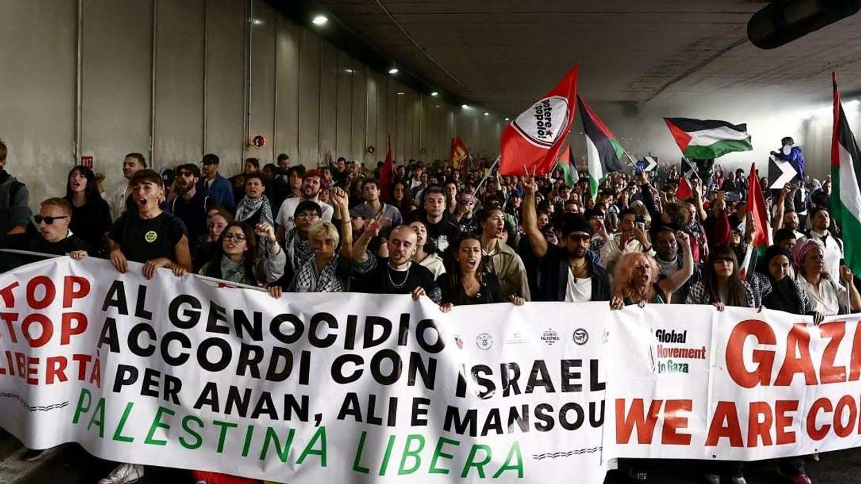 Pro-Palestinian demonstrators protest during a nationwide strike called by the USB union to condemn the Israeli forces' interception of the Global Sumud Flotilla vessels aiming to reach Gaza and break Israel's naval blockade, in Rome, Italy, October 3, 2025.