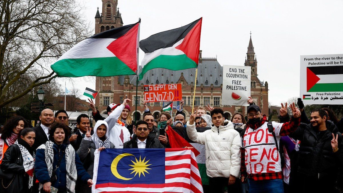 ​Pro-Palestinian protesters demonstrate outside the International Court of Justice (ICJ) on the day of a public hearing to allow parties to give their views on the legal consequences of Israel's occupation of the Palestinian territories before eventually issuing a non-binding legal opinion, in The Hague, Netherlands, February 19, 2024. 