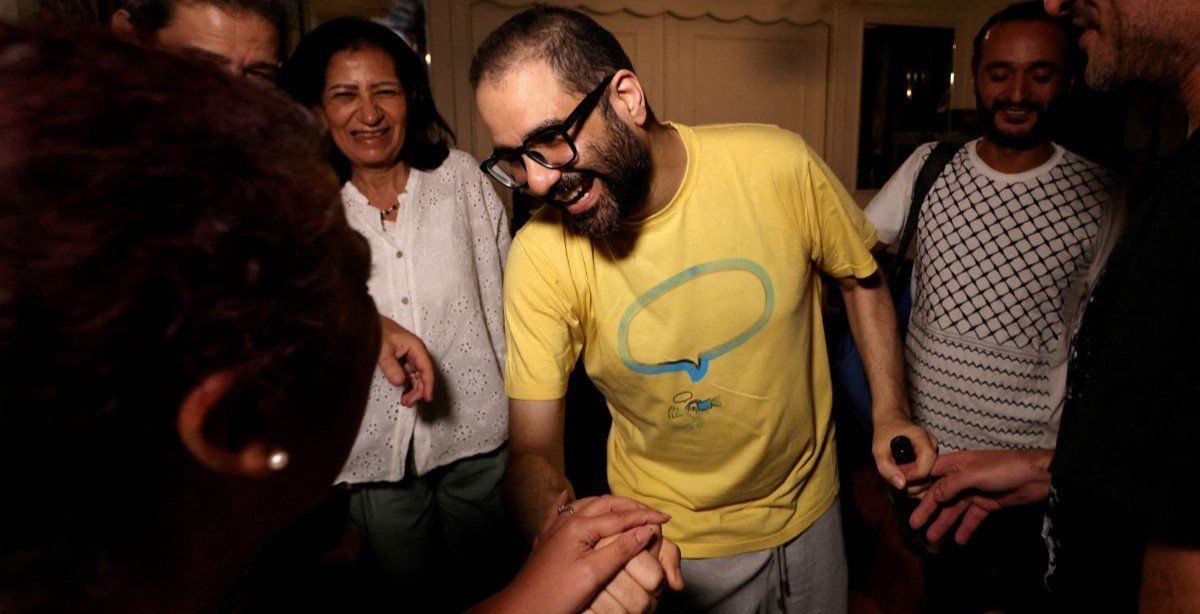 ​Prominent British-Egyptian activist Alaa Abd el-Fattah, who was released from prison after Egyptian President Abdel Fattah al-Sisi issued a presidential pardon for him, greets family and friends at their home in Giza, Egypt, September 23, 2025. 