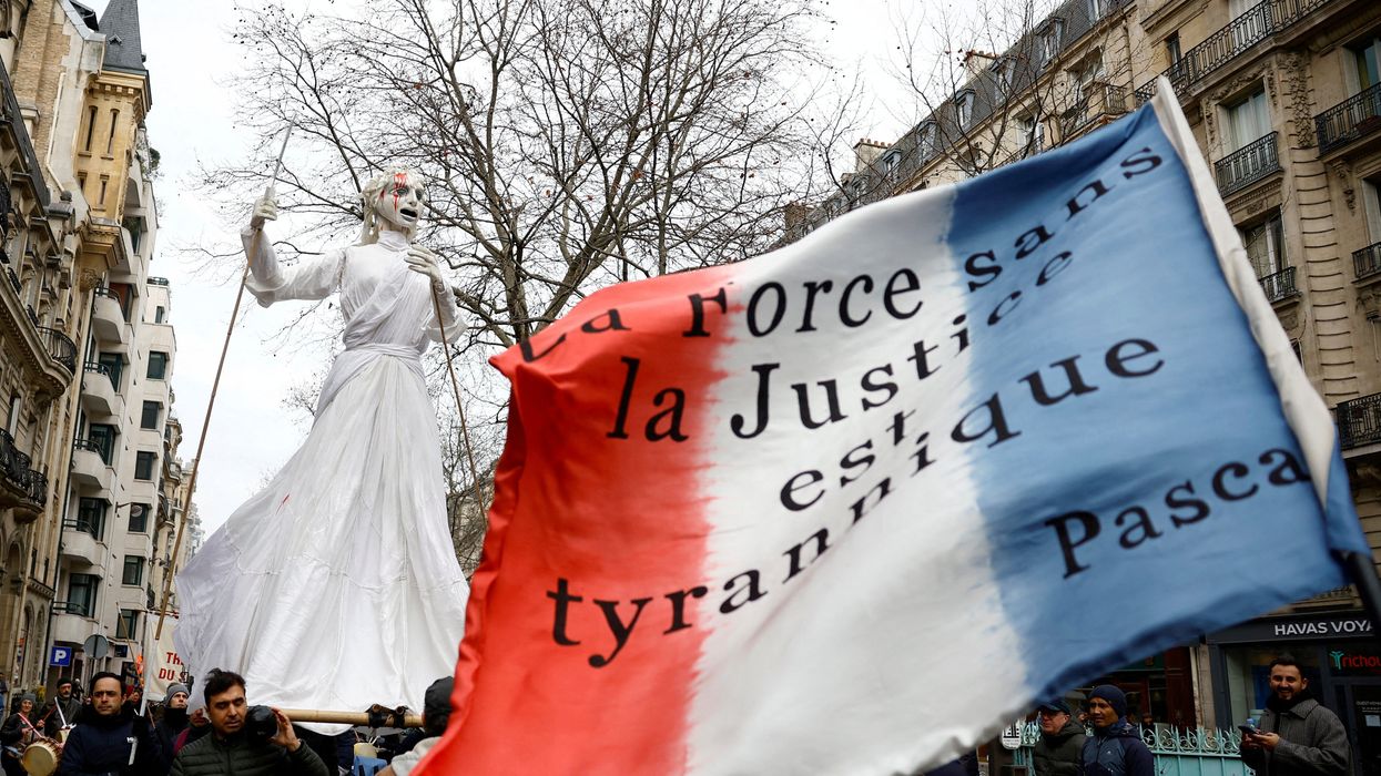 Protesters attend a demonstration against the French government's pension reform plan in Paris.