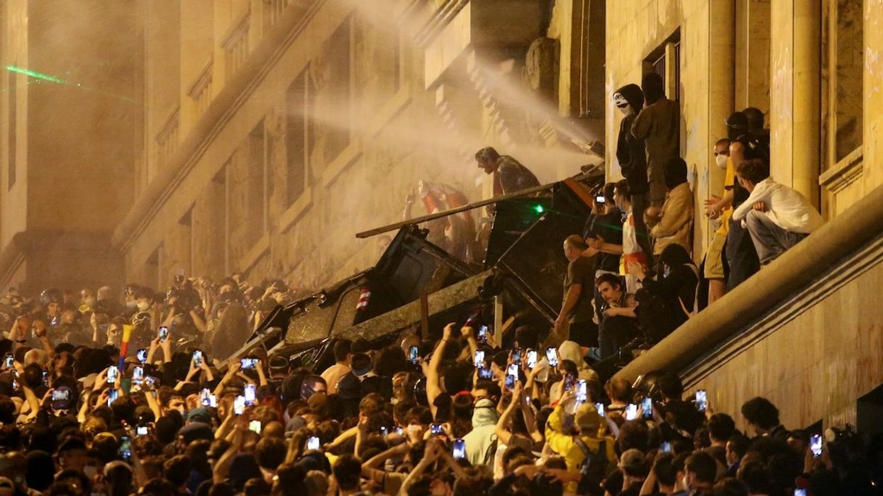 Protesters barricade the entrance of Parliament during a rally to protest against a bill on "foreign agents", in Tbilisi, Georgia, May 2, 2024.