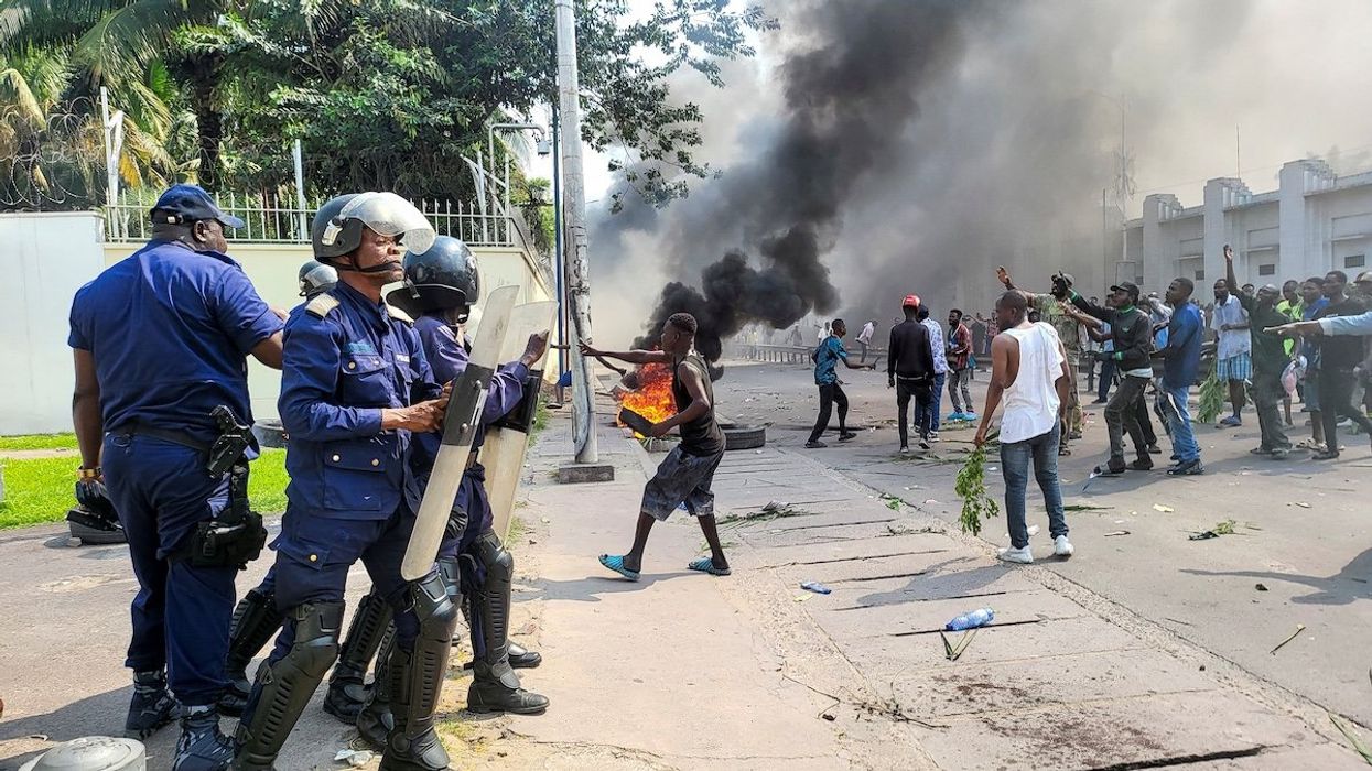 Protesters clash with riot police forces in front of the French Embassy in Kinshasa, Democratic Republic of Congo, on Jan. 28, 2025.