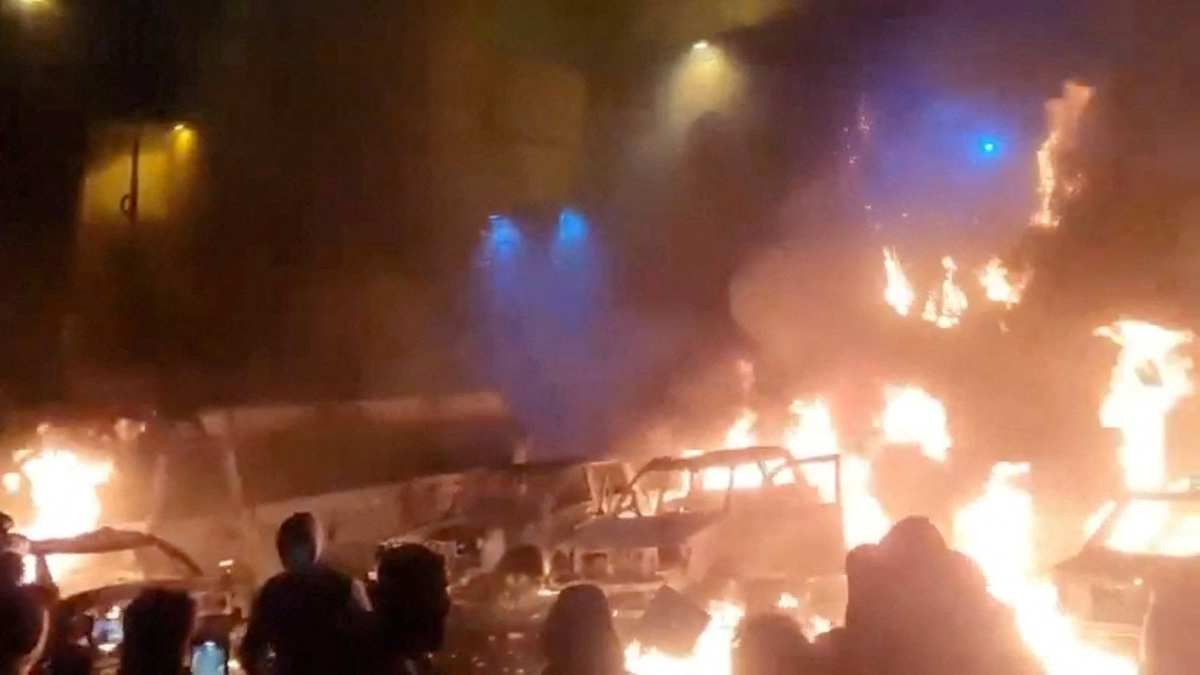 ​Protesters gather as vehicles burn in Tehran, Iran, in this screen grab from a social media video released on January 9, 2026.