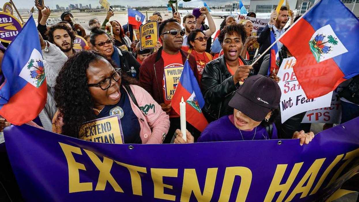 Protesters gather during a candlelight vigil, and interfaith prayer at Fort Lauderdale-Hollywood International Airport as airport workers and faith leaders rally calling on the federal government to extend Temporary Protected Status for Haiti on Jan. 28, 2026.