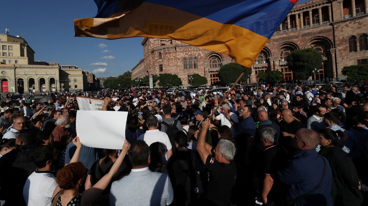 Protesters gather near the government building, after Azerbaijan launched a military operation in the region of Nagorno-Karabakh, in Yerevan, Armenia