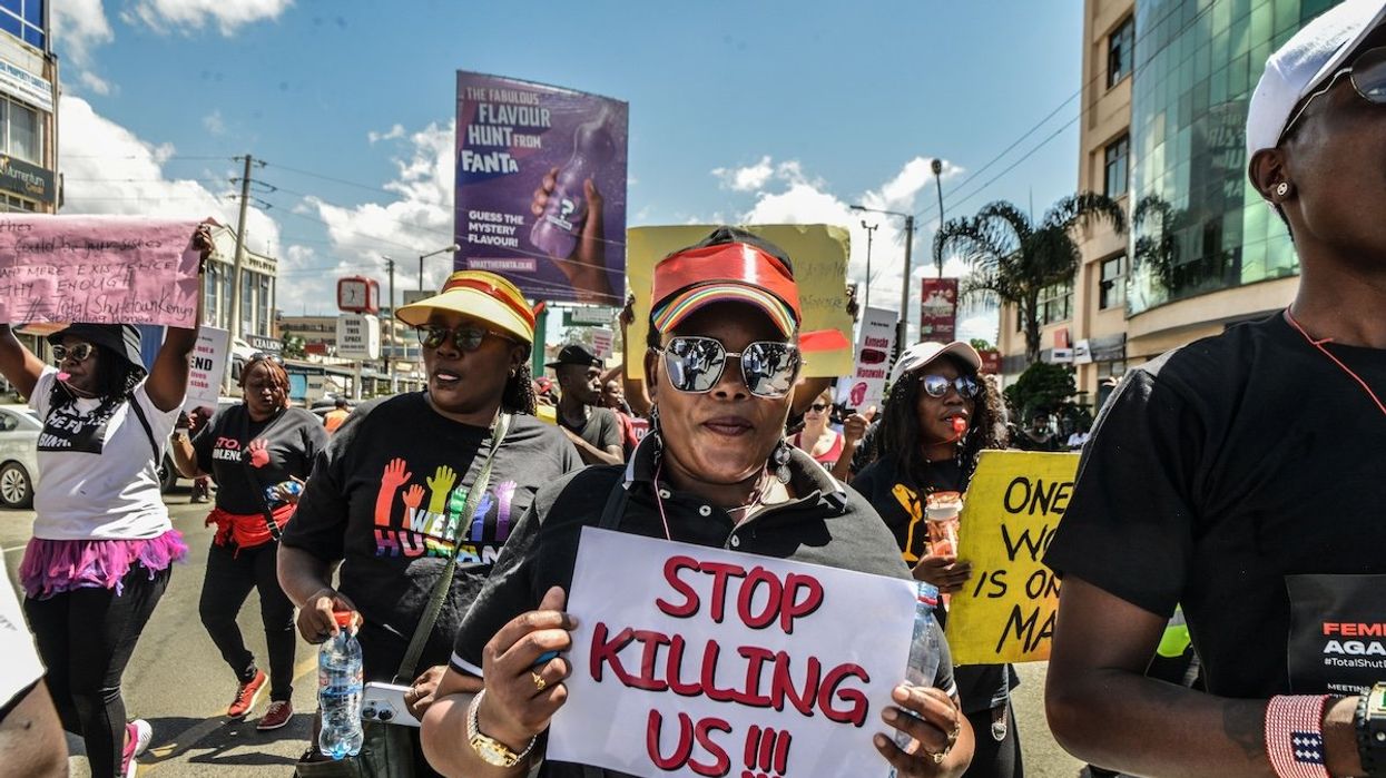 Protesters march while carrying placards and chanting slogans in the "Feminists March Against Femicide" in Kenya.